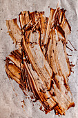 Smudged chocolate on parchment paper