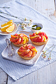 Oat crust tartlets with orange and pudding cream