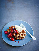 Cream tea waffles with cherry berry compote