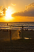 Tel Aviv bathers at sunset