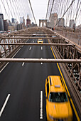 Yellow taxis on Brooklyn Bridge