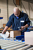 Man using a barcode reader in a warehouse