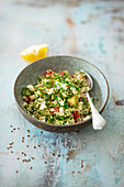 Couscous salad with feta, tomato, peppers, and linseed (vegetarian)