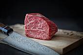 Kobe Wagyu beef steak with Japanese chef's knife