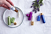Prepared inhaler pens next to small lavender bouquet
