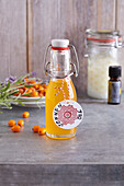 Homemade sun tan oil from sea buckthorn berries and lavender