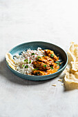 Butterhuhn-Curry (Murgh Makhani) mit Reis und Koriander