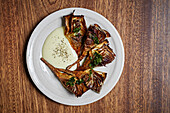Chargrilled artichokes with a herb sauce