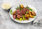 Beef steak with green asparagus and sauce gribiche