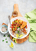 Chicken with rice and corn and tomato salsa