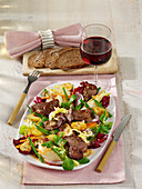 Warm beef salad with fennel, beans and mustard dressing
