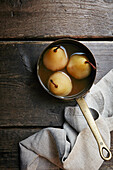 Poached pears in a saucepan
