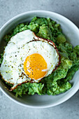 Mashed potato and broccoli with fried egg