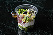 A healthy bowl with tuna, avocado and edamame to take away