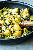 Potato and broccoli pan with feta cheese