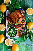 Roasted chicken with lemon and green peas shoots oil
