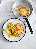 Small coconut pancakes with pineapple salad