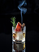 Whisky with grapefruit, rosemary and burning cinnamon stick