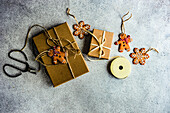 Christmas card with gift boxes decorated with ribbon on concrete background