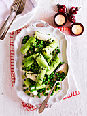 Steamed leeks and peas with herby vinaigrette