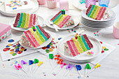 Pieces of rainbow cake at a birthday party