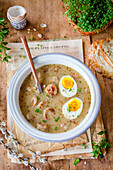 Easter sour rye soup with white sausage and egg