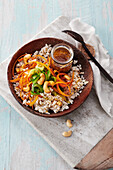 Pearl barley salad with carrots, cucumber, and cashew nuts