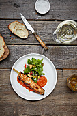 Grilled chicken skewers with olive and parsley salad