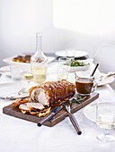 Roast loin of pork with sage and onion stuffing