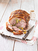 Slow roasted pork shoulder with leek, apricots and thyme