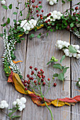 Wreath of snowberries, rosehips and heather