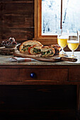 Stuffed bread on a rustic wooden table by the window