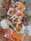 Heart shaped waffles with cottage cheese, berries, and apricots