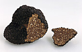 Summer truffle and truffle slice on a light background