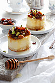Mini cheesecake with almonds figs and raisins in honey