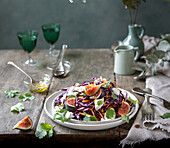 Red cabbage salad with figs, mint, coriander, carrot, burrata and honey vinaigrette
