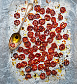 Sun-dried tomatoes with olive oil on baking paper