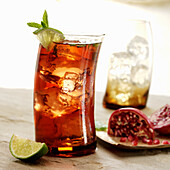 A glass of Pomegranate, lime and mint Iced Tea