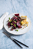 Roasted beets on a tray with almond feta