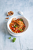 Carrot wholemeal spaghetti with chickpea sauce