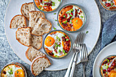 Baked Eggs with chorizo, tomatoes, peppers, and bread