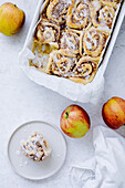 Apple and nut buns with cinnamon and icing