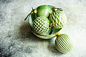 Vintage ceramic Christmas balls in interior decoration on concrete background