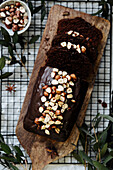 Spiced cake with nuts on a wooden board