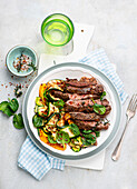 Beef with pepper and thyme with a courgette salad