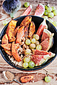 Vegan autumn bowl with quinoa and cinnamon pumpkin porridge