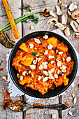 Vegan potato curry with pumpkin and peanuts
