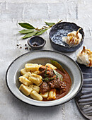 Beef stew with gnocchi and garlic