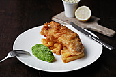 Beer battered fish and chips with mushy peas