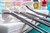 Surgical scissors with swabs in an operating theatre